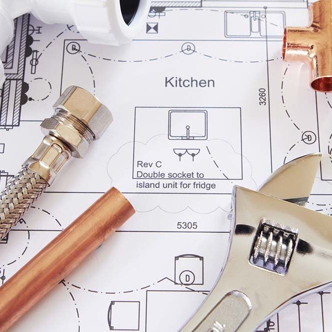 Plumbing Still Life Of Plumbing Tools Arranged On House Plans